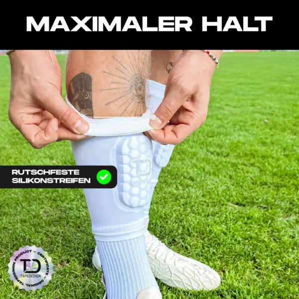 Weiße Tapedesign Schienbeinschoner Sleeve für optimalen Schutz und Komfort beim Sport, detaillierte Nahaufnahme.